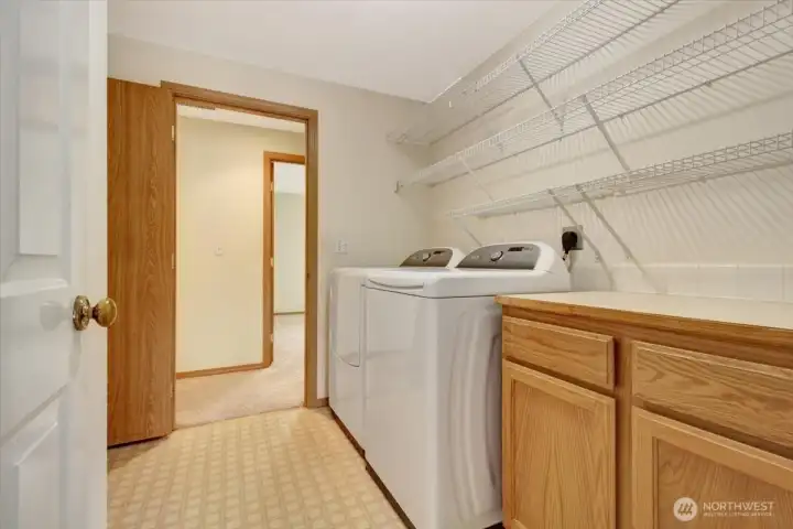 Utility room with room for freezer behind door to left