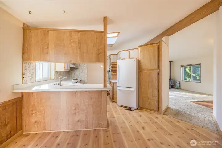 Kitchen opens to a wonderful "flex" space.