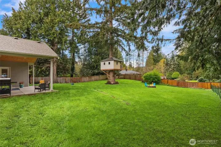 Enjoy relaxing and fun in your large private yard with treehouse and zipline!