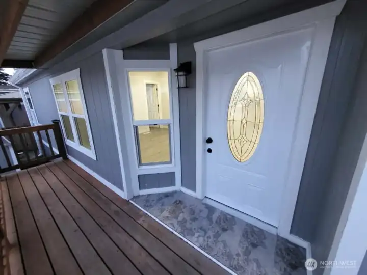 PRIMARY ENTRANCE (SIDE OPPOSITE OF STREET) - COVERED DECK AREA