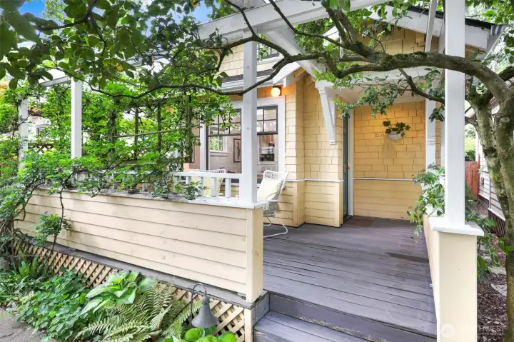 This 1916 bungalow is part of a small 10-unit cluster of cottages (this is 1 of only 2 accessed within the courtyard which means it has its own private fenced backyard with 2nd deck as well) centered around a serene, gated courtyard. This front porch entry greets you as you come home each day!