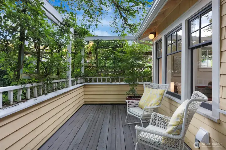This 1916 bungalow is part of a small 10-unit cluster of cottages (this is 1 of only 2 accessed within the courtyard which means it has its own private fenced backyard with 2nd deck as well) centered around a serene, gated courtyard. This front porch entry greets you as you come home each day!
