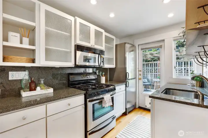 Plenty of efficient storage space, a gas range, and easy access to your second private deck - great for summer BBQs (back deck includes stub-out for natural gas BBQ)!