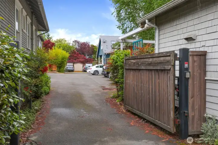 Secure access via coded gate for parking lot, with a gate that opens directly to this cottage. Or leave the car at home to easily stroll & explore this fantastic neighborhood.