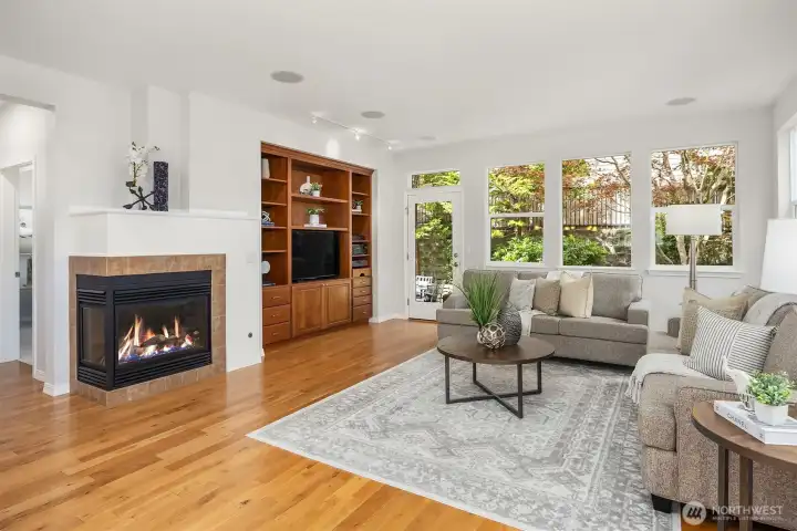 Cozy and warm with a gas fireplace complete with stunning cherry wood built-ins Cozy and warm with a gas fireplace complete with stunning cherry wood built-ins