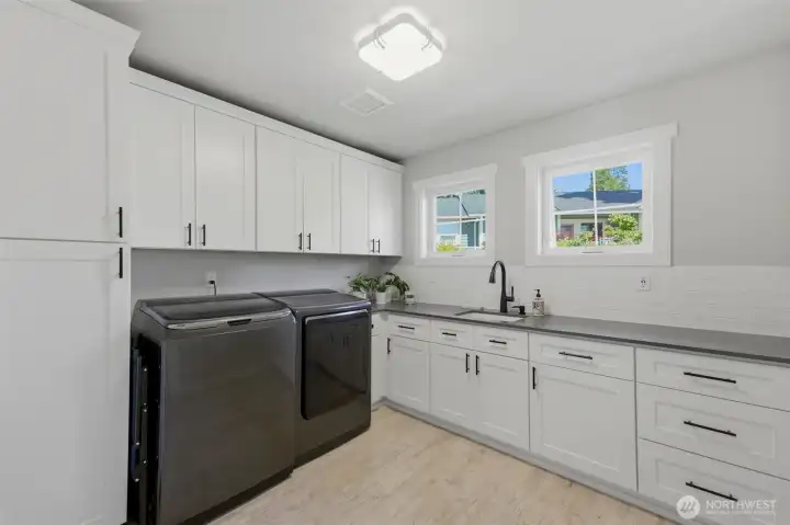 A large laundry room just off the entry hall. A large laundry room just off the entry hall.