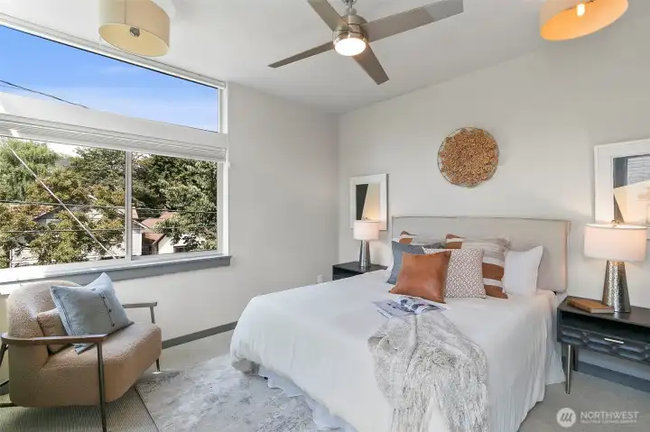 Primary bedroom suite includes custom shades. Primary bedroom suite includes custom shades.