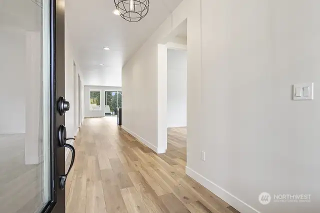 Entry way with 2 bedrooms to the right. Photo not of actual home. Colors and finishes may very.