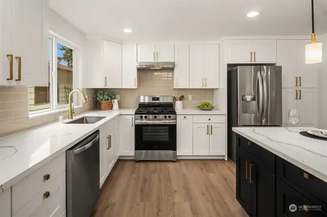 Featuring solid wood soft close cabinetry.  Next to the fridge is a full sized pantry.
