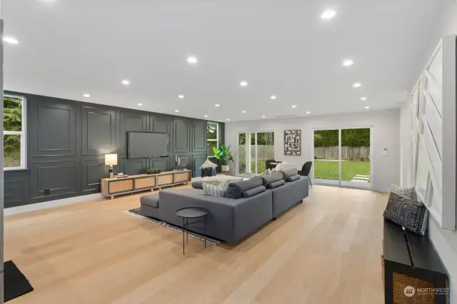 1st level family room.  Walk out to sizable flat back yard. This level includes separate exterior entrance (upper right hand corner of this photo).