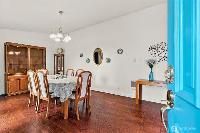 Step inside, you are greeted by the expansive dining room with engineered hardwood floors.