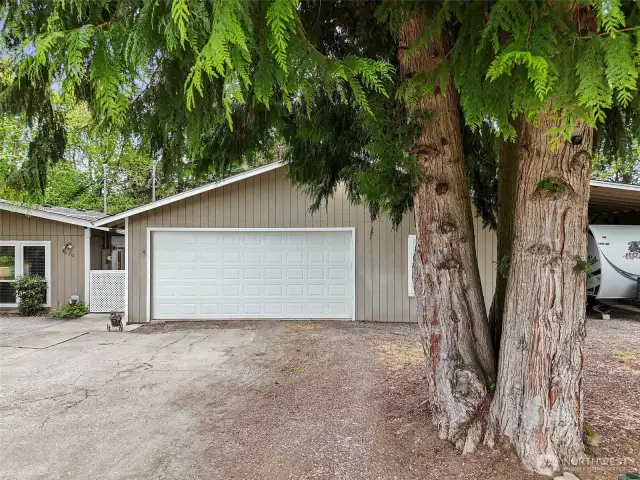 Detached 2-car garage plus covered RV parking!  Space for all of your toys!