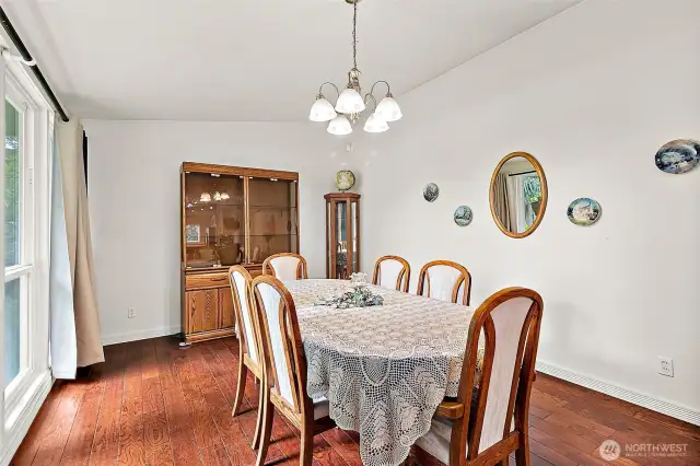 Vaulted ceiling and floor-to-ceiling windows fills this room with natural light.