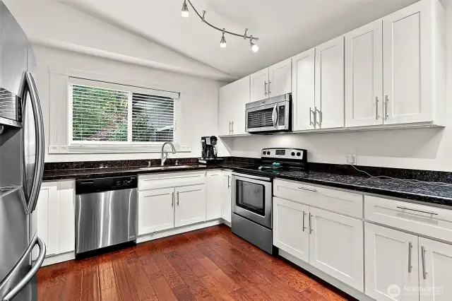 Clean, crisp white shaker cabinets throughout.