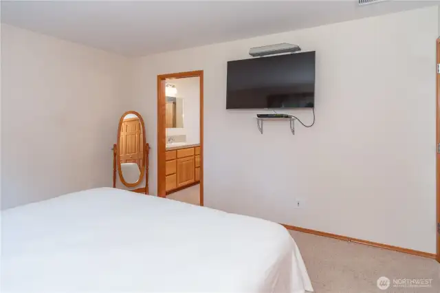 The en-suite bathroom is through the door to the left.