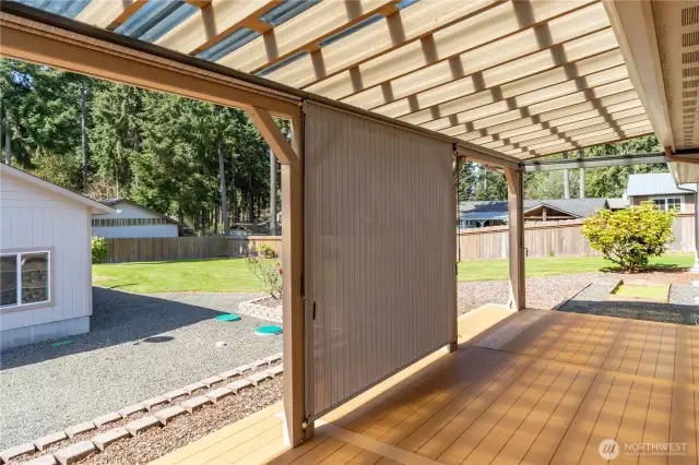 Covered deck has pull down sun shades as shown in the center section.