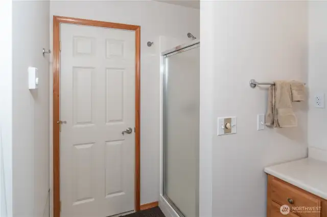 The bathroom shop features a walk-in shower.