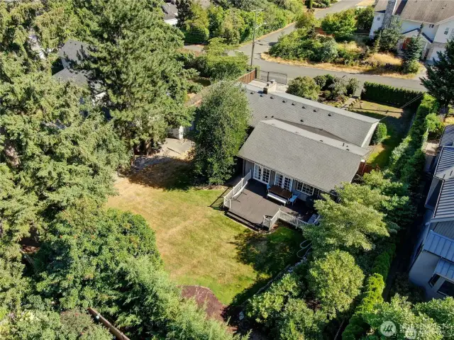 Spacious backyard with a complete fence and a newly upgraded, oversized entertainment deck.