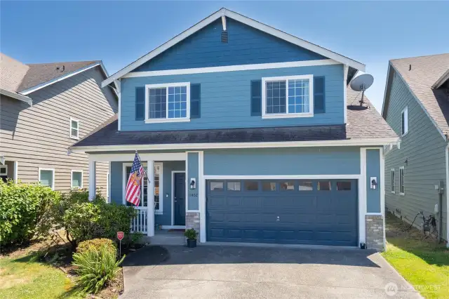 Front elevation view showcasing architectural details and covered entry
