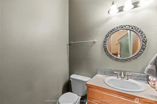 Convenient powder room with decorative mirror