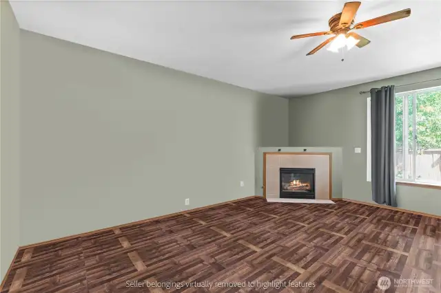 Comfortable living room with gas fireplace and ceiling fan