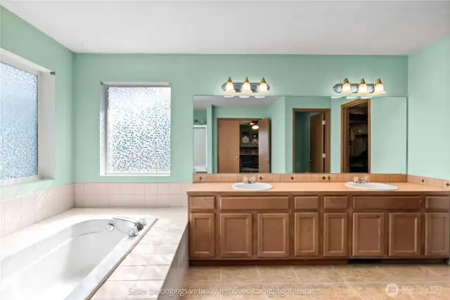Primary vanity area with dual sinks and mirror setup