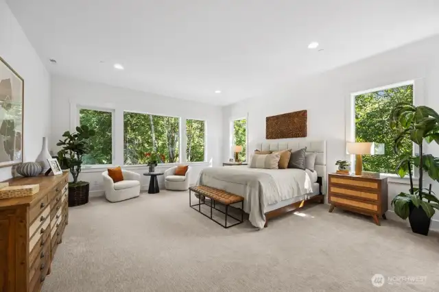 Primary suite is a private sanctuary with peaceful views.