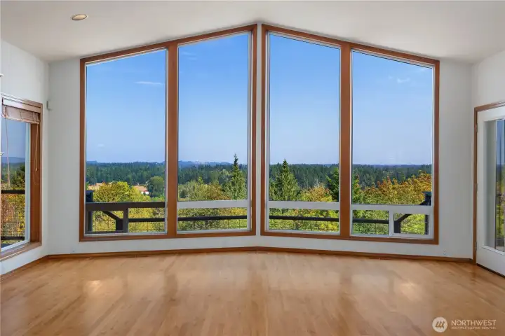 Vaulted Great room with floor to ceiling windows that frame the stunning views!