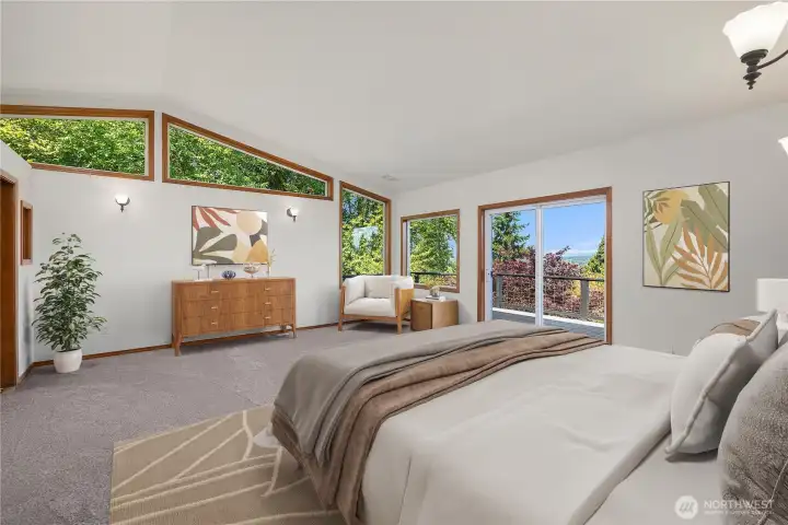 Large primary suite with private access to expansive deck. Natural light abounds!