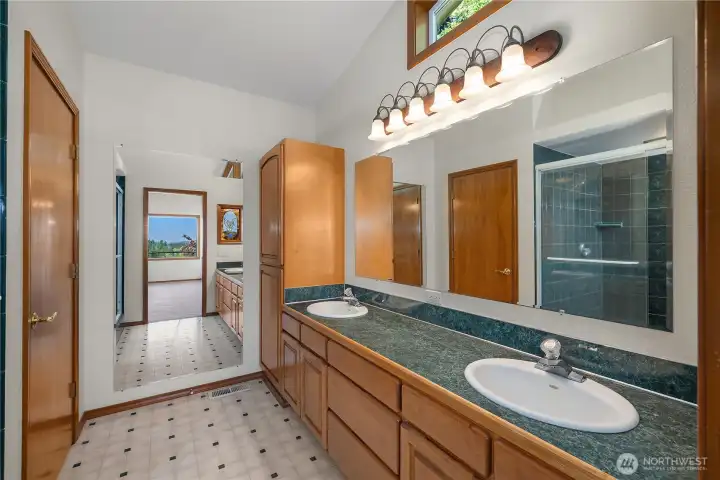 Primary bathroom and tiled walk-in shower.