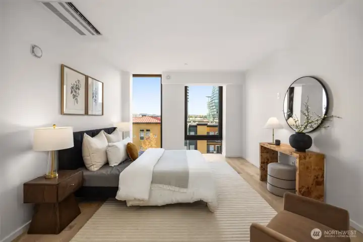 Primary bedroom with an oversized walk-in closet and a minisplit.