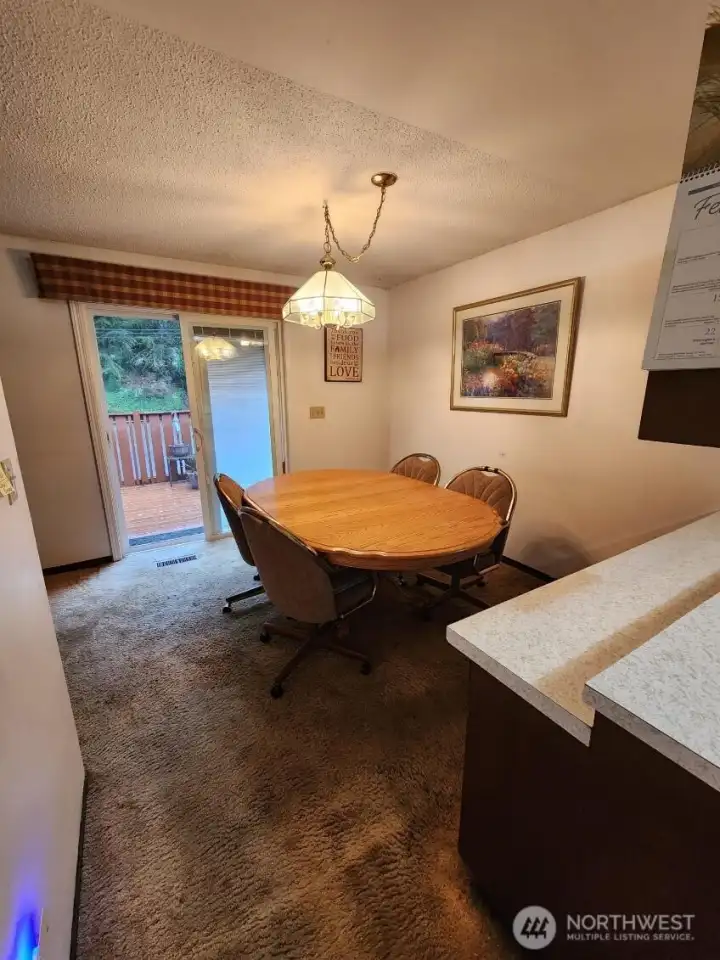 living leads to the dining that has sliders to the deck