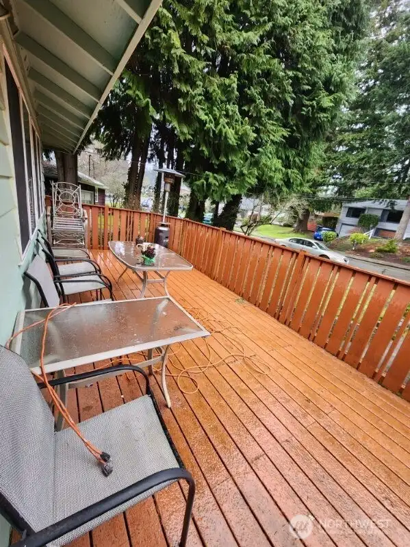 deck runs width of house and is large enough to double as covered parking
