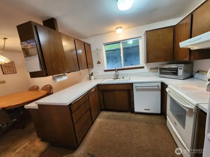 back into the dining room, it has a counter for stools, large functional kitchen, plenty of cabinet space