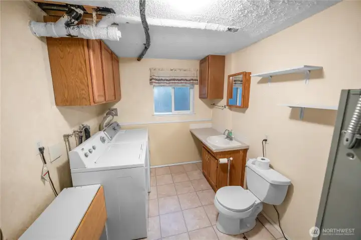 utility room has a convenient 1/2 bath
