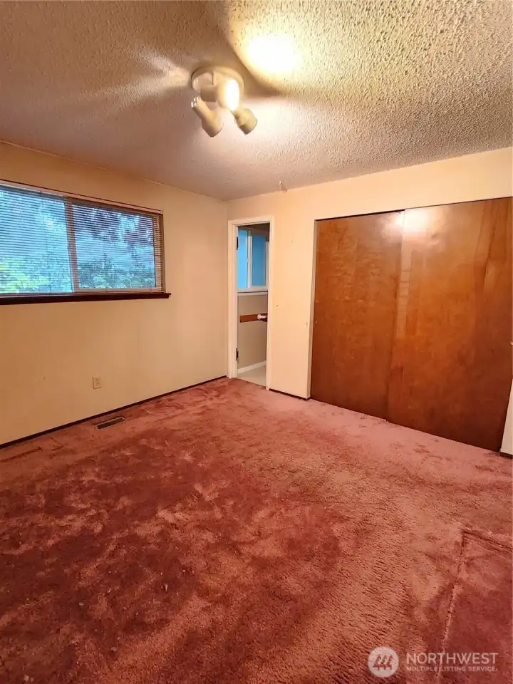 large enough for a King sized bed, that door leads to the primary bathroom