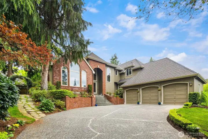 Polished and welcoming exterior. The property features a well-maintained lawn, attractive landscaping, and a charming curb appeal, creating a positive first impression.