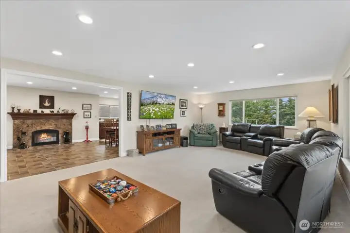 Upstairs light-filled living room that flows easily into the dining room & kitchen
