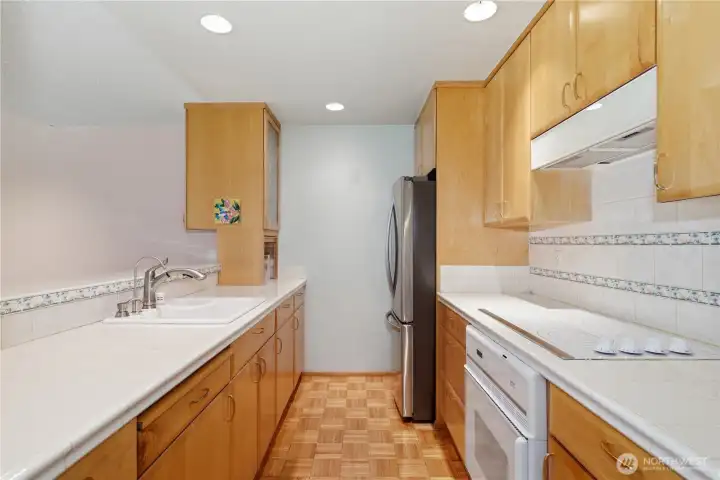 Maple cabinets, original parquet flooring and newer SS refrigerator Maple cabinets, original parquet flooring and newer SS refrigerator
