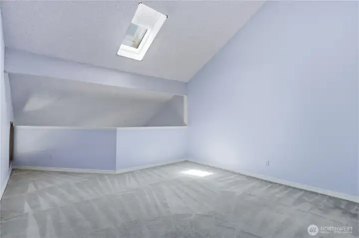 Large spacious primary bedroom with skylight that opens with shade. Large spacious primary bedroom with skylight that opens with shade.