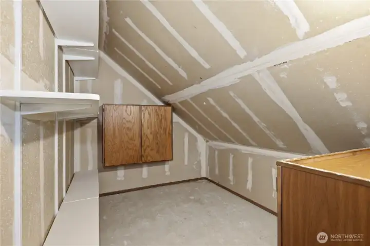 Large shelved storage room upstairs Large shelved storage room upstairs