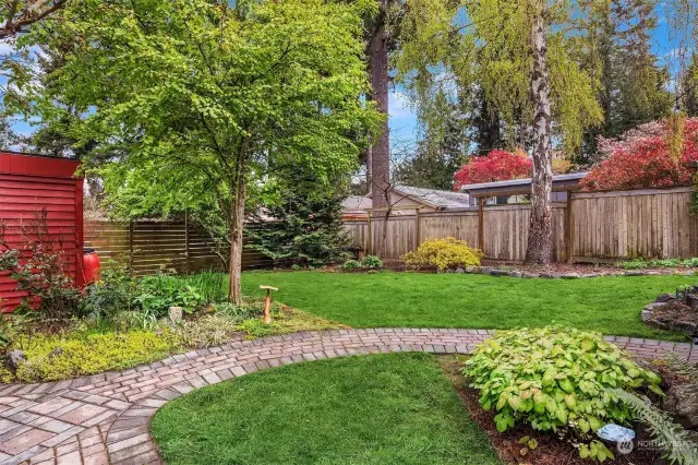 Manicured, mature landscaping. The backyard is fully fenced.