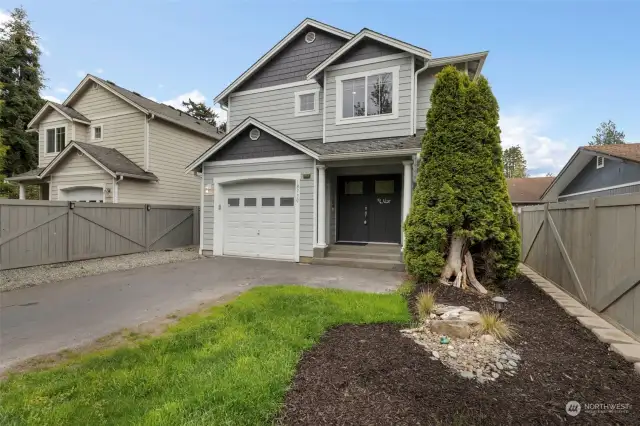 Front of home with attractive double doors & glass for light. Home is completely fenced from front to back & all around. Only a couple of minutes walk to the beach, pier, boat launch, community parks & restaurants. A short drive to Bainbridge & the ferry to Seattle.