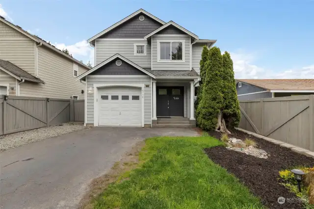Front of home with attractive double doors & glass for light. Home is completely fenced from front to back & all around. Only a couple of minutes walk to the beach, pier, boat launch, community parks & restaurants. A short drive to Bainbridge & the ferry to Seattle.