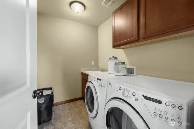 The utility room is conveniently located on the second level.