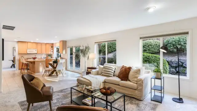 This view showcases the great room adjacent to the kitchen, offering a perfect space for hosting guests and entertaining.