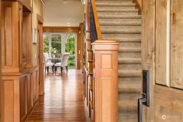 Enter to a statement of beautifully detailed wood trim and moldings, providing warmth and sophistication, and prefinished hand scraped-style 5" wide plank solid wood floors throughout the main floor.