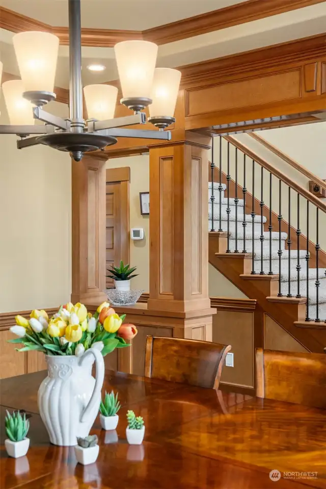 The large formal dining room carries all of the warm style and detail with shadow boxes and a coffered ceiling shown here providing a setting for elegant, special events and holidays with guests, friends and family.