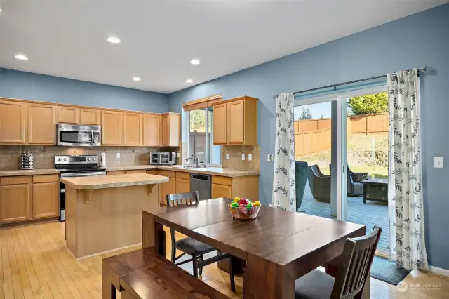 Dining area off kitchen, slider to back yard.