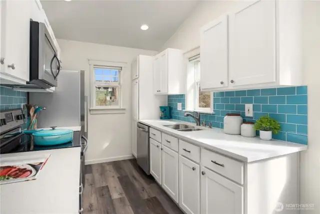 This well laid out kitchen boasts great storage and counter space and LVP flooring.